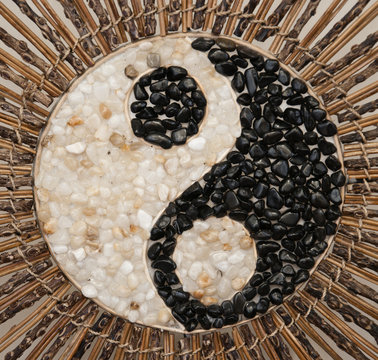 yin yang symbol made of pebble stones