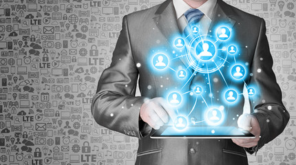 Business man using tablet PC social connection