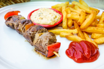 tasty grilled meat and vegetables skewers