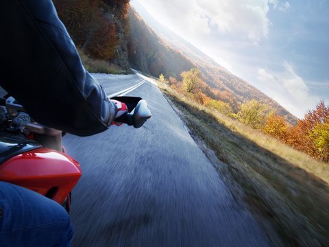 Fototapeta Race motorcycle with traveling in forest road.