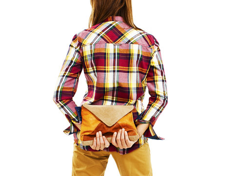 Back View Of Woman In Plaid Shirt Holding A Handbags