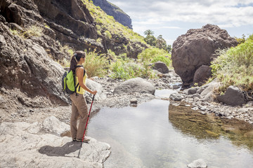 young woman hiking in tropical nature