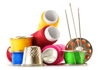 Composition with tailor needles and threads over white