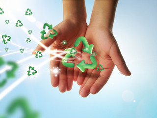 Woman hands holding recycle sign