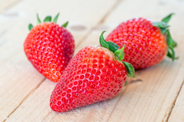 Close up of big strawberry on wood 