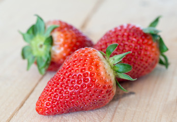 Close up of big strawberry on wood 