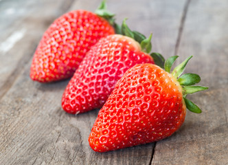 Close up of big strawberry on wood 