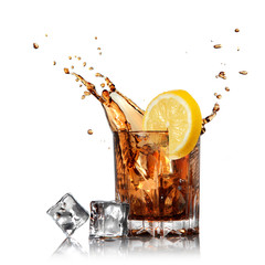 splash of cola in glass with lemon and ice isolated on white