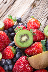 berries on wooden background.