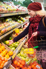young woman shopping for fruit