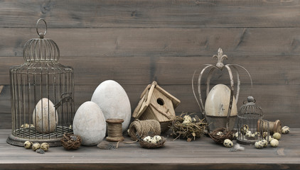 easter decoration with eggs, nest and vintage birdcage