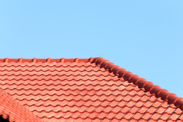 roof under construction with stacks of roof tiles for home build