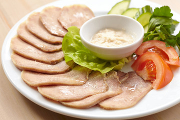 Slices of boiled beef tongue