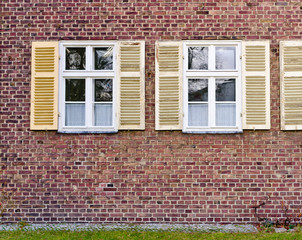 Windows in brick wall