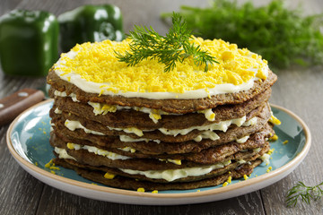 Cake pancakes from the liver with eggs and greens.