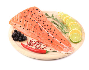 raw red  fish on wooden board