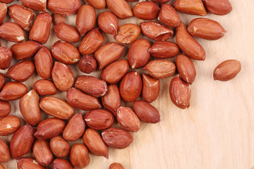 Close up of peanuts  on wooden board