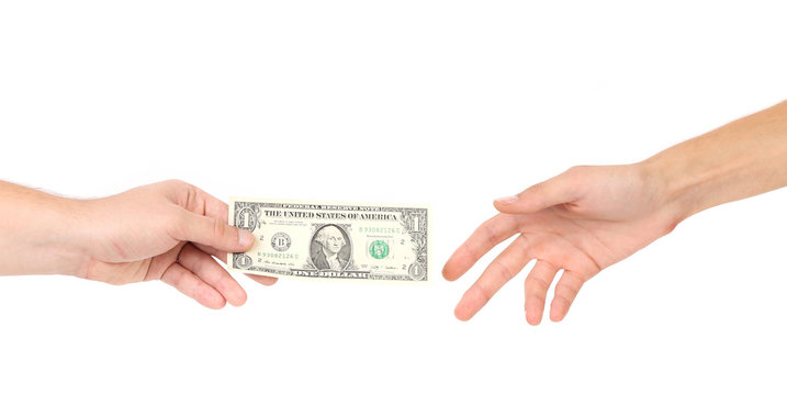 Hand handing over money to another