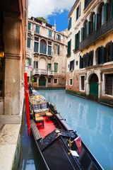 Fototapeta na wymiar Gondola embanked on canal