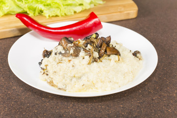 Millet porridge with mushrooms