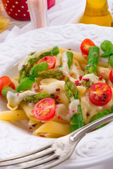 Noodles with asparagus in cream-cheese sauce