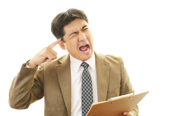 頭痛を訴えるビジネスマン