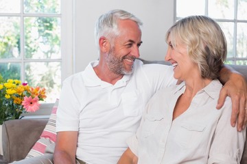 Cheerful mature couple looking at each other
