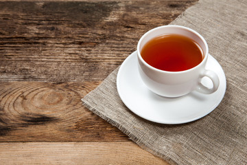 Cup of tea on old wooden table