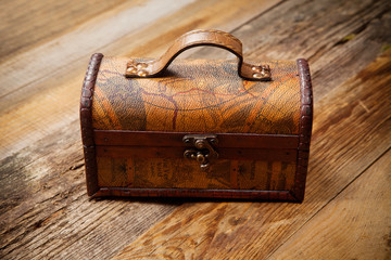 Old chest on wooden table