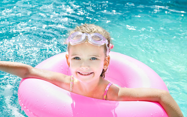 Cute little girl in swimming pool