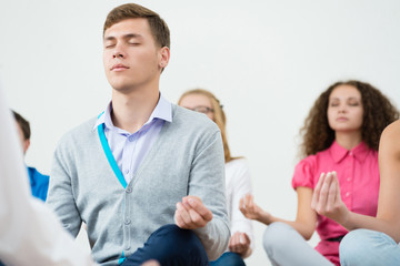 Fototapeta premium group of young people meditating