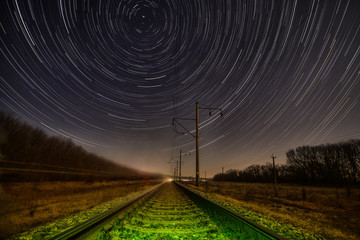 Night rails -green way with motion stars, stratrails skyes - 63023264