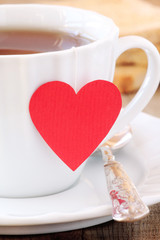 Cup of tea with red heart teabag