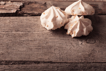 meringue cookies on wooden background