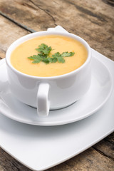 Pea soup on wood weathered background