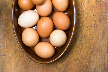 Organic, free-range eggs in terracotta bowl