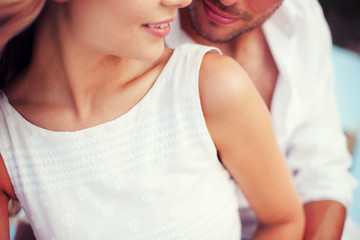 couple in shades at sea side