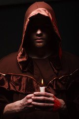 mysterious Catholic monk. studio shot