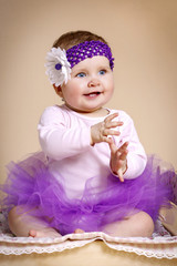 Beautiful baby girl with headband in tutu skirt © allari