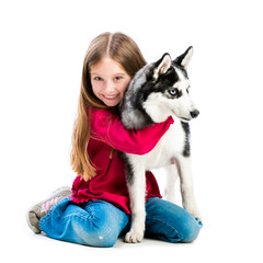 little girl is with husky dog