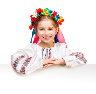 Girl In  Ukrainian  Costume Behind White Board