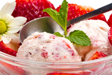 Strawberry ice cream with fruits close up