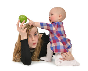 Fototapeta premium mother and child baby boy kid with healthy green apple