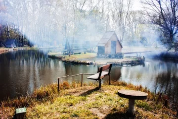 Fotobehang Fishing lake and smoke © oliverleicher