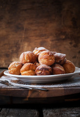 Fried Donuts on Wooden Background