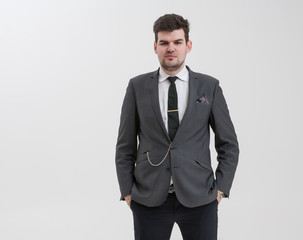 Handsome man makes a gesture with his hand.