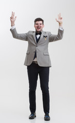 Businessman doing hand gestures. A man raises his hands up.