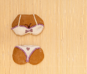 bikini shape gingerbread cookie on bamboo mat
