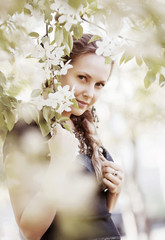 Beautiful woman in a spring garden