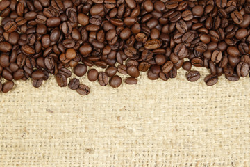 Coffee beans on sack background